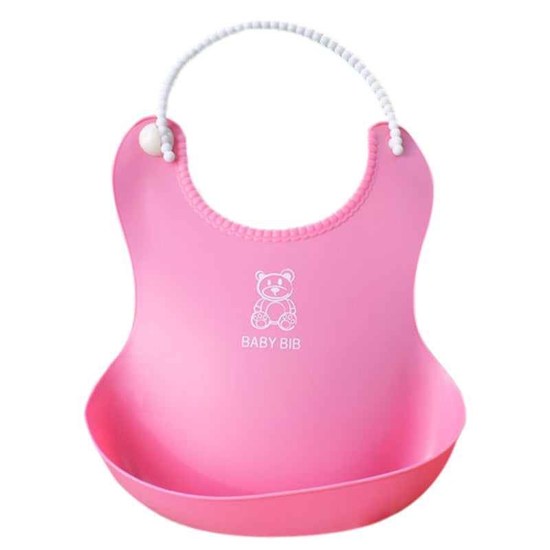 Pink silicone baby bib by Baby Bliss Haven, designed with a bear face and comfortable fit, perfect for messy baby feeding activities.