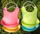 Two colorful silicone baby bibs by Baby Bliss Haven, including pink and green, both designed with fun bear graphics and easy to wear.