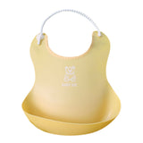 Yellow silicone baby bib by Baby Bliss Haven, designed with a cheerful bear motif and a practical pocket for catching spills during feeding.