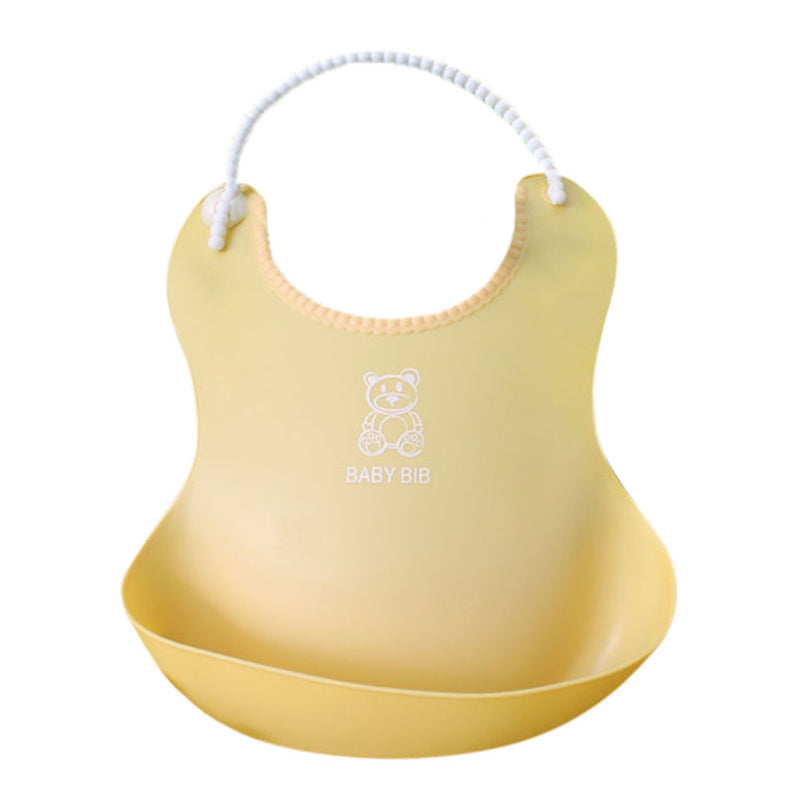 Yellow silicone baby bib by Baby Bliss Haven, designed with a cheerful bear motif and a practical pocket for catching spills during feeding.